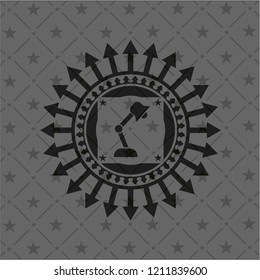 desk lamp icon inside black badge