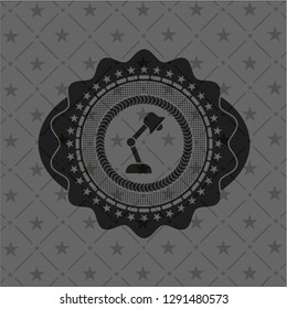 desk lamp icon inside black badge