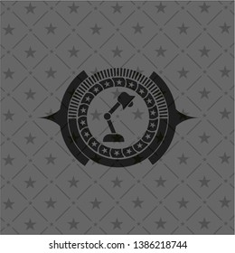 desk lamp icon inside black badge
