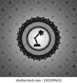 desk lamp icon inside black badge