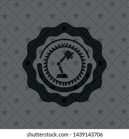 desk lamp icon inside black badge