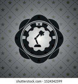 desk lamp icon inside black emblem