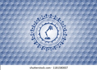 desk lamp icon inside blue polygonal badge.