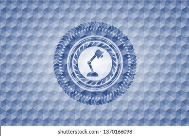 desk lamp icon inside blue badge with geometric pattern background.