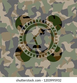 desk lamp icon inside camouflaged emblem