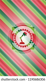 desk lamp icon inside christmas badge.