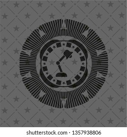 desk lamp icon inside dark badge