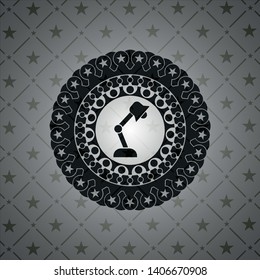 desk lamp icon inside dark emblem