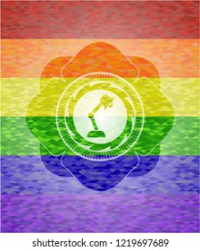 desk lamp icon inside emblem on mosaic background with the colors of the LGBT flag