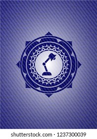 desk lamp icon inside emblem with denim texture