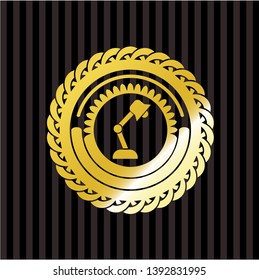 desk lamp icon inside gold badge or emblem