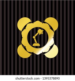 desk lamp icon inside gold emblem