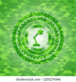 desk lamp icon inside green emblem. Mosaic background
