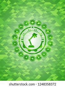 desk lamp icon inside green emblem. Mosaic background