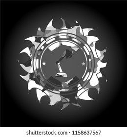 desk lamp icon inside grey camouflage emblem