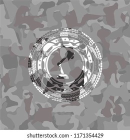 desk lamp icon inside grey camo emblem
