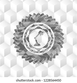 desk lamp icon inside grey emblem with cube white background