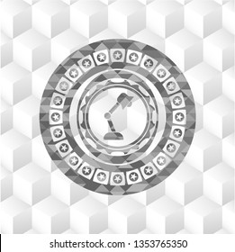 desk lamp icon inside grey emblem with geometric cube white background