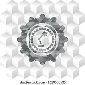 desk lamp icon inside grey icon or emblem with geometric cube white background