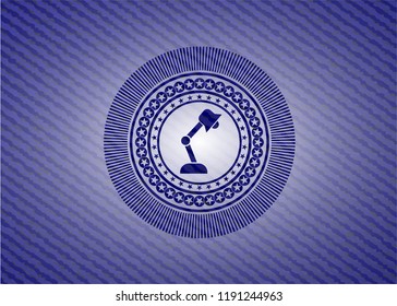 desk lamp icon inside jean or denim emblem or badge background