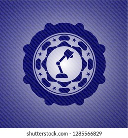 desk lamp icon inside jean or denim emblem or badge background