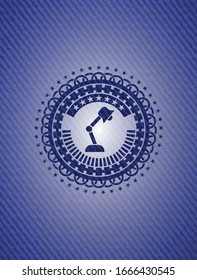 desk lamp icon inside jean or denim emblem or badge background