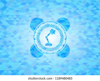 desk lamp icon inside light blue mosaic emblem