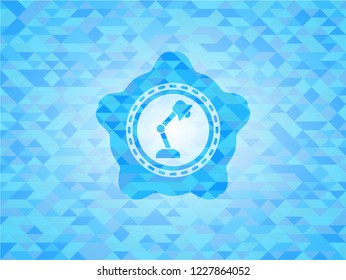 desk lamp icon inside light blue mosaic emblem