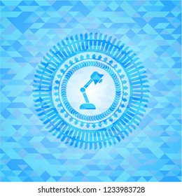 desk lamp icon inside light blue emblem with triangle mosaic background