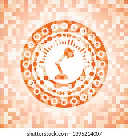 desk lamp icon inside orange mosaic emblem