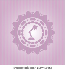 desk lamp icon inside pink emblem