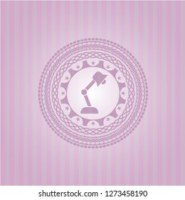 desk lamp icon inside pink emblem