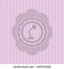 desk lamp icon inside pink icon or emblem