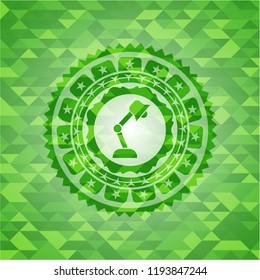 desk lamp icon inside realistic green mosaic emblem