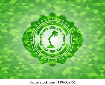 desk lamp icon inside realistic green mosaic emblem