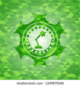 desk lamp icon inside realistic green emblem. Mosaic background