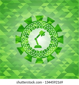 desk lamp icon inside realistic green emblem. Mosaic background
