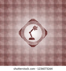 desk lamp icon inside red seamless badge with geometric background.