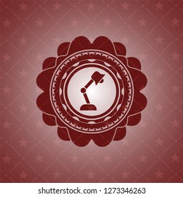 desk lamp icon inside red icon or emblem