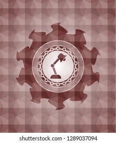 desk lamp icon inside red emblem or badge with abstract geometric polygonal pattern background. Seamless.