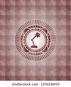 desk lamp icon inside red seamless badge with geometric pattern background.