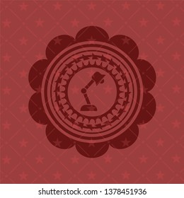desk lamp icon inside red emblem