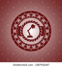 desk lamp icon inside red icon or emblem