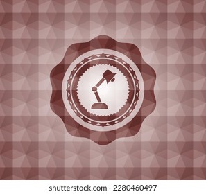 desk lamp icon inside red seamless emblem with geometric pattern background. 