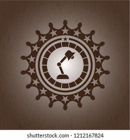 desk lamp icon inside retro wooden emblem