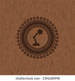 desk lamp icon inside retro wooden emblem