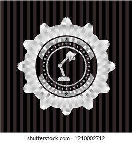 desk lamp icon inside silver emblem