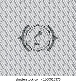 desk lamp icon inside silver shiny badge. Scales pattern. Vector Illustration. Detailed.