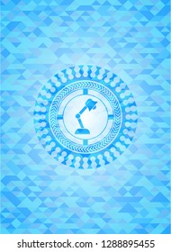 desk lamp icon inside sky blue mosaic emblem