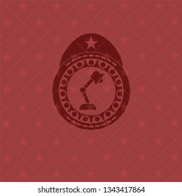 desk lamp icon inside vintage red emblem